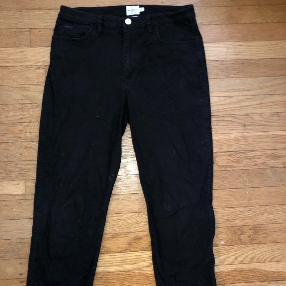 Short black Calvin Klein pants.